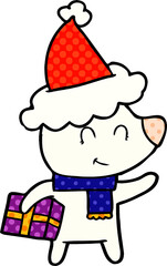 female polar bear with christmas present wearing santa hat