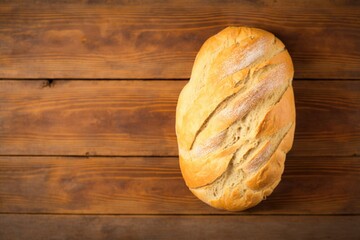 delicious freshly baked bread on a tea towel on the brown wooden table