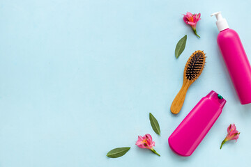 Hair care and styling products with brush, top view