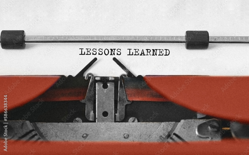 Poster text lessons learned typed on retro typewriter