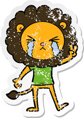 distressed sticker of a cartoon crying lion giving peace sign