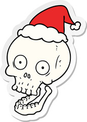 sticker cartoon of a skull wearing santa hat