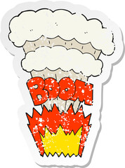 retro distressed sticker of a cartoon explosion
