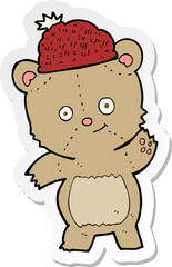 sticker of a cartoon bear in hat