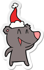 laughing bear sticker cartoon of a wearing santa hat