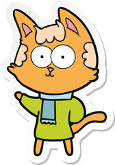sticker of a happy cartoon cat in winter clothes