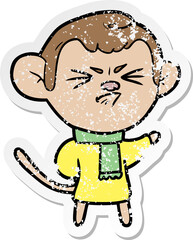 distressed sticker of a cartoon annoyed monkey
