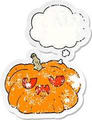 cartoon pumpkin and thought bubble as a distressed worn sticker