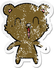 distressed sticker of a happy laughing cartoon bear