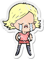 distressed sticker of a cartoon girl crying