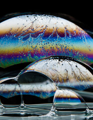 Soap bubble on black background