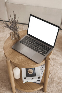 Lifestyle photo mockup of new trendy laptop with empty white screen in beige neutral scandinavian room for paste own social media, web site design and other for presentation for business and sell 
