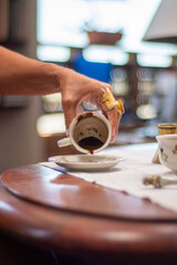 Coffee grounds reading. Fortune teller. Esoteric. Fortune telling. Woman reading fortune. cafeomancy