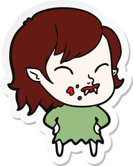 sticker of a cartoon vampire girl with blood on cheek