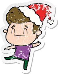 happy distressed sticker cartoon of a man wearing santa hat