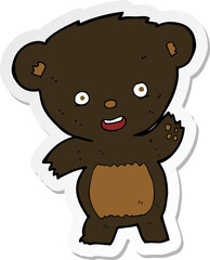 Fototapeta premium sticker of a cartoon waving black bear