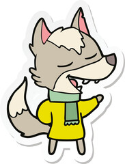 sticker of a cartoon wolf in scarf laughing