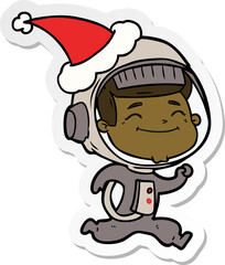 happy sticker cartoon of a astronaut wearing santa hat