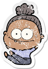 distressed sticker of a cartoon happy old woman