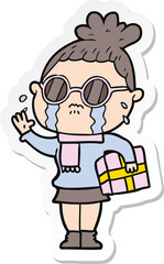 sticker of a cartoon crying woman wearing spectacles