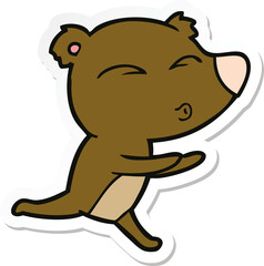 sticker of a cartoon running bear