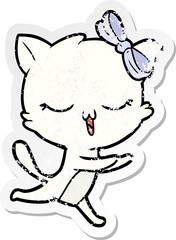 distressed sticker of a cartoon cat with bow on head