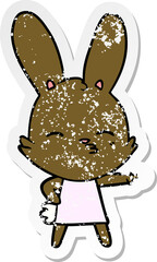 distressed sticker of a curious bunny cartoon