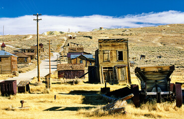 Bodie gold mining ghost town. Northern California, USA. Abandoned deserted wooden buildings of Main...