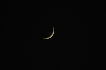 Obraz na płótnie Canvas Crescent Moon, Mesmerizing Crescent Moon in a Starry Night Sky
