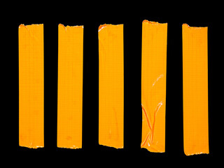 5 vertical pieces of orange adhesive tape isolated on a black - Powered by Adobe