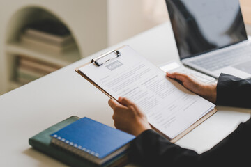 Conduct job interviews and send resumes to staff. employee job application concept at office