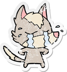 distressed sticker of a cartoon crying wolf