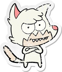 distressed sticker of a cartoon grinning fox