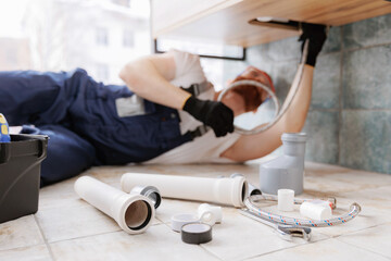 Plumber man at work in bathroom, fix repair service. Concept assemble and install plumbing