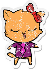 distressed sticker of a cartoon cat with bow on head