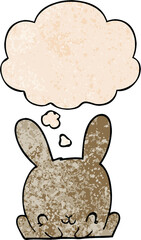 cartoon rabbit and thought bubble in grunge texture pattern style