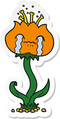 sticker of a cartoon flower crying