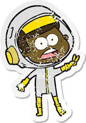 distressed sticker of a cartoon surprised astronaut