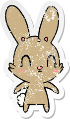 distressed sticker of a cute cartoon rabbit