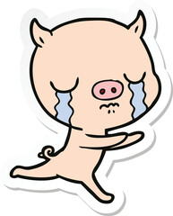 sticker of a cartoon pig crying