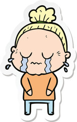 sticker of a cartoon crying old lady