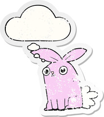 cartoon bunny rabbit and thought bubble as a distressed worn sticker