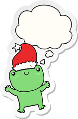 cute cartoon frog wearing christmas hat and thought bubble as a printed sticker