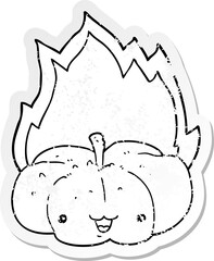 distressed sticker of a cartoon flaming pumpkin