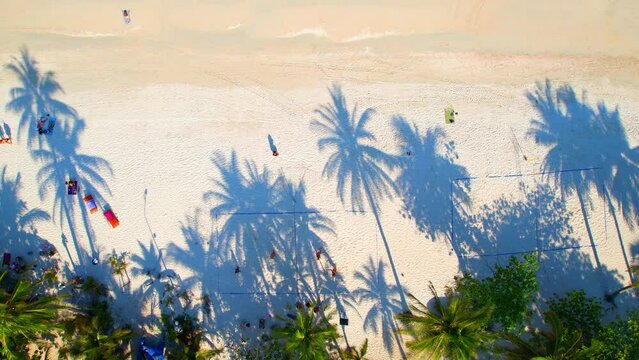 Despite its popularity among tourists, Haad Rin still retains a laid-back, relaxed atmosphere, making it a great place to escape the crowds and soak up the sun. (Koh Phangan, Thailand). 4K Drone
