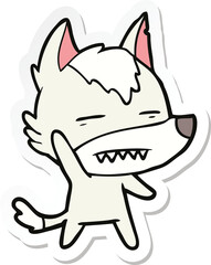 sticker of a cartoon wolf waving showing teeth