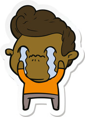 sticker of a cartoon man crying