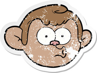 distressed sticker of a cartoon monkey face