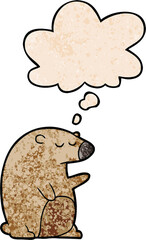 cartoon bear and thought bubble in grunge texture pattern style