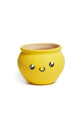 Close-up shot of an empty yellow ceramic pot for flowers. A funny flower pot with a smiley face is isolated on a white background. Front view.